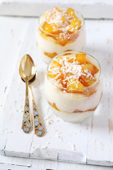 Two glasses of homemade rice coconut milk cream  pudding with caramelized pineapple, dessert