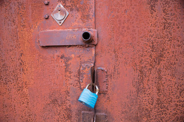 Old lock on a rusty gate