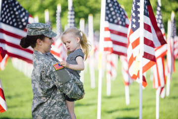 American Female soldier with a little girl