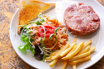 Vegetable salad and ham steak
