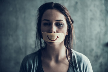 Oppressed beaten woman cries. - obrazy, fototapety, plakaty
