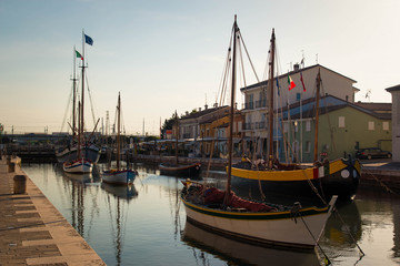 Fototapeta na wymiar colorful historic boats in Porto Canale, cesenatico, Italy.
