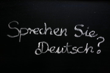 Sprechen Sie Deutsch (do you speak German) question on chalkboard