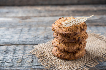 Oatmeal cereal cookies on napkin burlap wood table