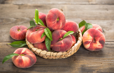 Fresh saturn peaches in the basket