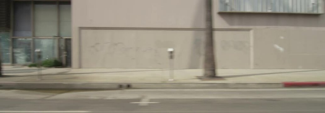 Right Side view of a Driving Plate. Car turns left from Gower Street onto Sunset Boulevard and continues to Highland Avenue in Los Angeles, California.