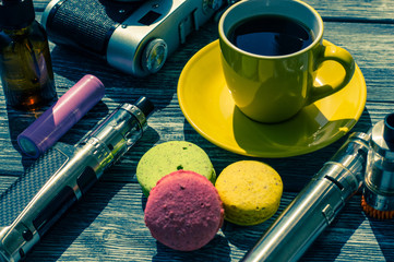 Still life with e-cig and jiuce on the wooden background