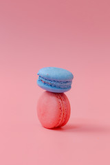 Blue and Pink  macaroons on pink background.