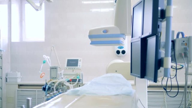 Empty operating table is in a surgery room. 4K.