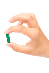 Fototapeta premium Green capsule in hand