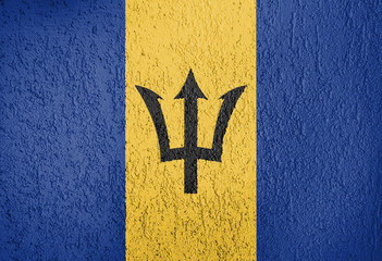 Texture of the Barbados flag on a white wall of plaster.