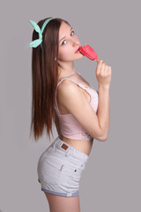 girl with pink ice cream on gray background