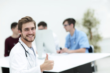 smiling doctor showing thumb up