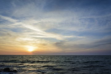 Naklejka na ściany i meble Sunset over the black sea, dramatic and vibrant sky..