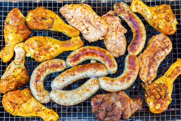 Chicken meat on a grill rack.