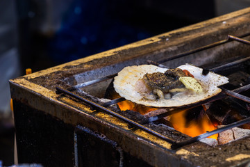 The roasted scallops seasoning with garnish japanese style.