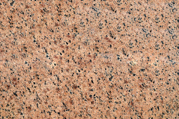 Background of crystal granite with fine black and gray grains.