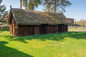 Obraz premium Old wooden farmstead in Kluki. Poland