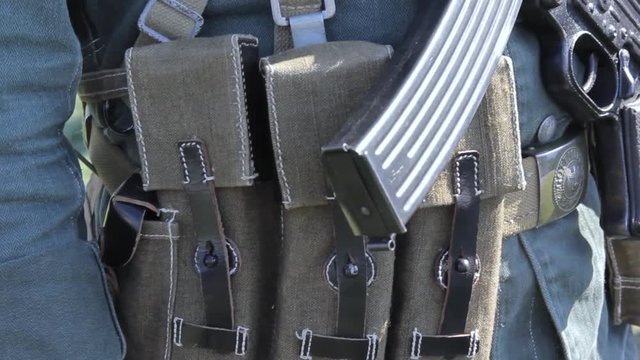 military uniform with a soldier's weapon