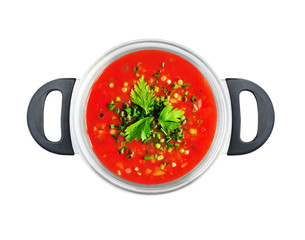 Top view of red tomato soup or sauce in saucepan isolated on white background