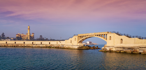 Bridge in the sea at Montazah park with the Royal palace in the far distance with calm sea at...