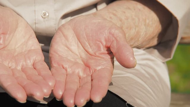 Hands of the elderly. Hands of an elderly woman close-up.