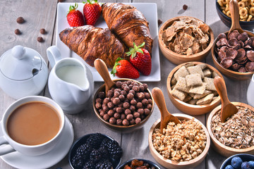 Different sorts of breakfast cereal products and fresh fruits