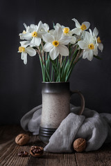 A bouquet of daffodils on a wooden background