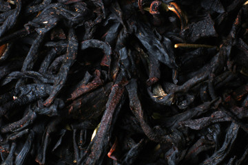 Black tea texture. Dry black sheet tea.
