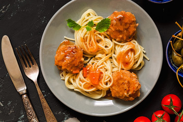 Meatballs with macaroni close-up, top view. Italian food .Spaghetti with meatballs.