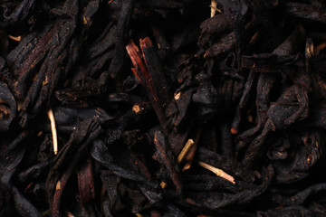 Black tea texture. Dry black sheet tea.