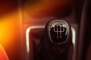 Manual gearbox with light, close-up on a dark background - obrazy, fototapety, plakaty