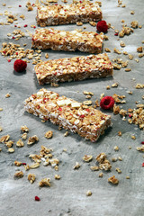 Granola bar. Healthy sweet dessert snack. Cereal granola bar with nuts, fruit and berries