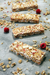 Granola bar. Healthy sweet dessert snack. Cereal granola bar with nuts, fruit and berries