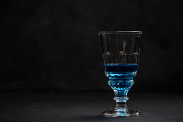 Crystal glass shoot with blue Absinthe