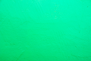 Wall painted in blue texture. Seamless texture of a light pale green concrete wall. Abstract background.