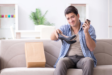 Man receiving wrong parcel with female woman shoes
