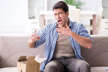 Man receiving wrong parcel with glasses