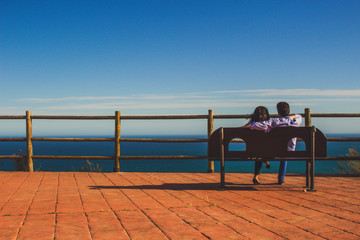 Fototapeta na wymiar Couple. A view from the viewpoint over the hill near The Buddhist Stupa in Benalmadena town. Fuengirola and Mediterranean sea. Benalmadena, Malaga, Spain. Picture taken – 29 April 2018.