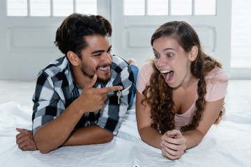 Happy couple with key of new home