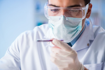 Lab assistant testing blood samples in hospital