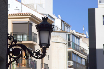 Fototapeta na wymiar An old street lamp on a European street.