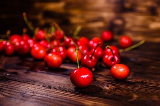 Fresh ripe cherries on wooden table