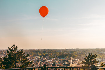red ball on a sunset background over the historical center of ,