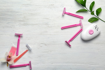 Set for epilation on wooden background, flat lay