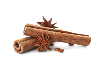 Aromatic cinnamon sticks and anise on white background