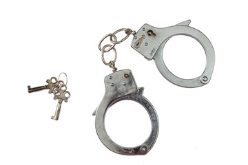 Metal handcuffs isolated on white background, top view