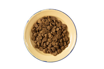 Fototapeta premium Dogs or cats dry food in a metal bowl isolated on white background, top view