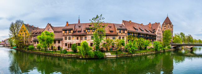 Historical brick houses on shore of river Pegnitz in Central Nurnberg, Germany.