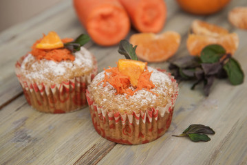 Carrot Healthy Muffins Cupcakes Buns on a WoodenRustic board. Homemade Food.